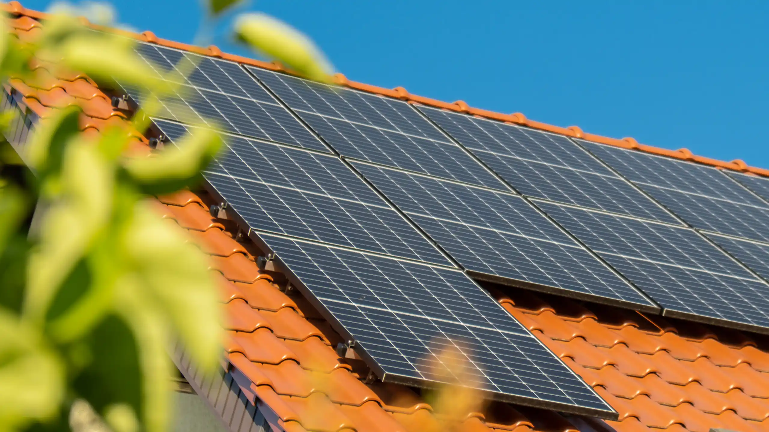 solar-panels-on-residential-tiled-roof-clear-day